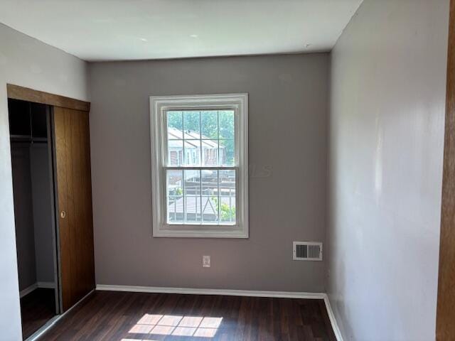 2382 Hardesty Dr S Unit Q5, Columbus, OH 43204 - unfurnished bedroom with dark wood-type flooring and a closet