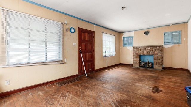 1822 W Mound St, Columbus, OH 43223 - unfurnished living room featuring hardwood / wood-style flooring and a stone fireplace
