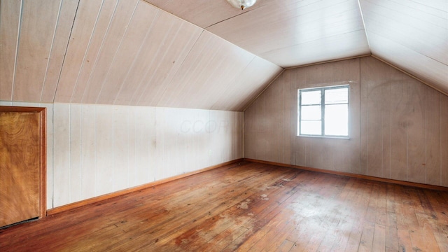 1822 W Mound St, Columbus, OH 43223 - additional living space with hardwood / wood-style flooring, vaulted ceiling, and wood walls