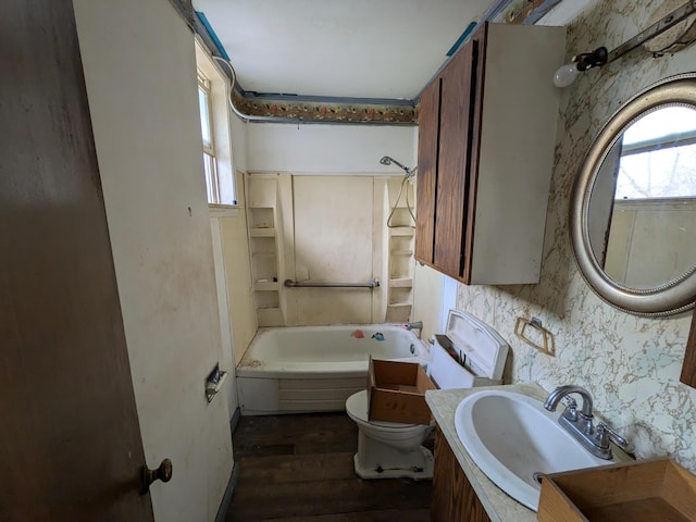 1325 Smith Rd, Columbus, OH 43207 - bathroom with wood finished floors, vanity, and washtub / shower combination