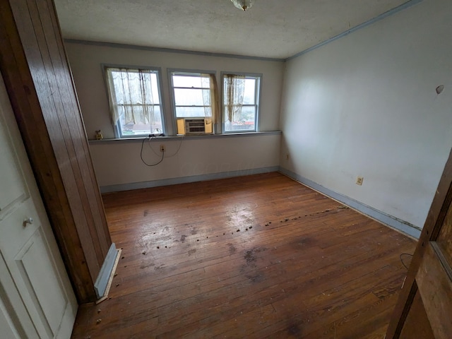 1325 Smith Rd, Columbus, OH 43207 - unfurnished room with hardwood / wood-style flooring, ornamental molding, cooling unit, and a textured ceiling