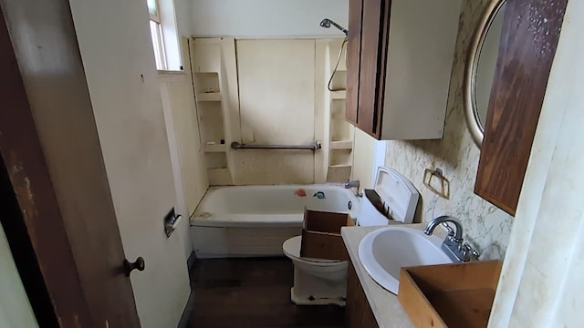 1325 Smith Rd, Columbus, OH 43207 - full bathroom with vanity, wood finished floors, and tub / shower combination