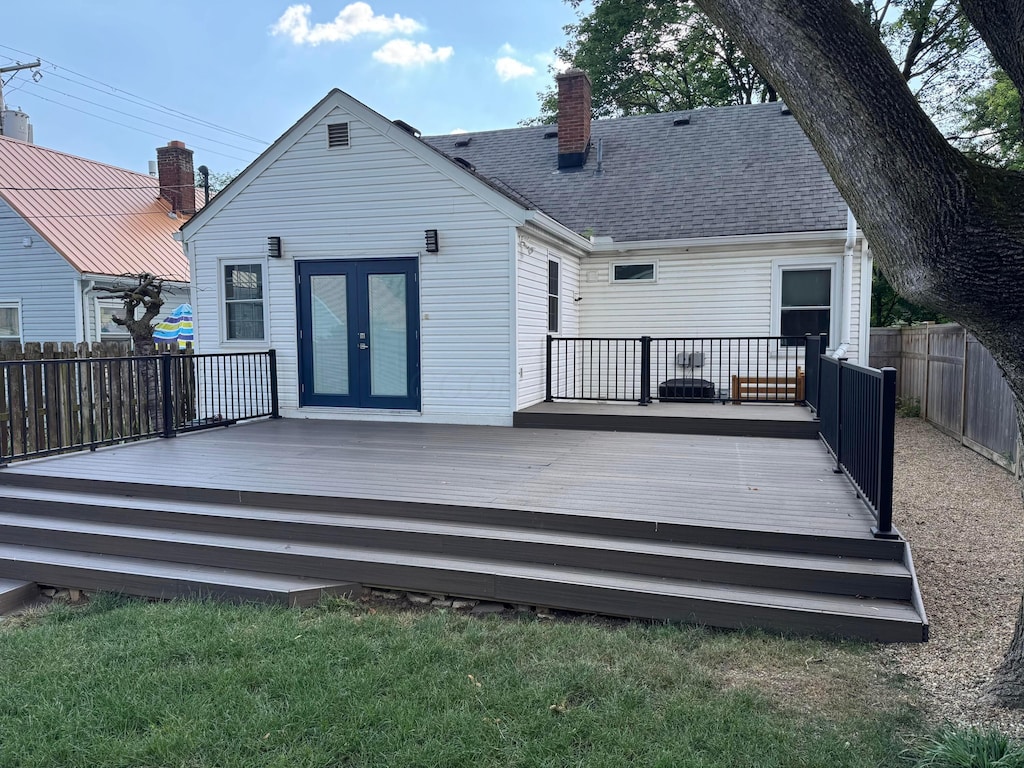 814 Oxley Rd, Columbus, OH 43212 - rear view of property with french doors, a fenced backyard, a chimney, a deck, and a shingled roof