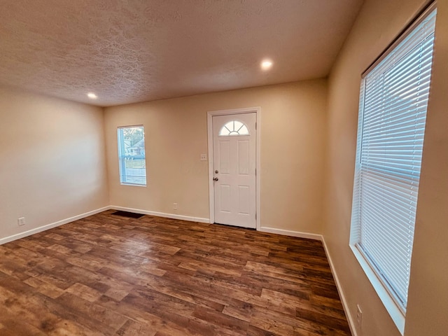 3067 E 13th Ave, Columbus, OH 43219 - foyer entrance with dark wood finished floors, recessed lighting, and a textured ceiling