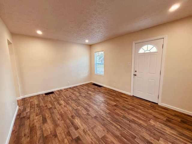3067 E 13th Ave, Columbus, OH 43219 - foyer with dark wood finished floors, recessed lighting, and a textured ceiling