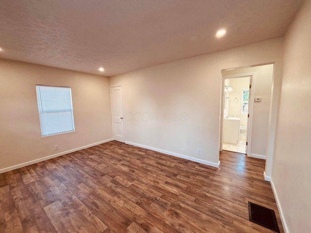 3067 E 13th Ave, Columbus, OH 43219 - unfurnished room with dark wood-style flooring and recessed lighting