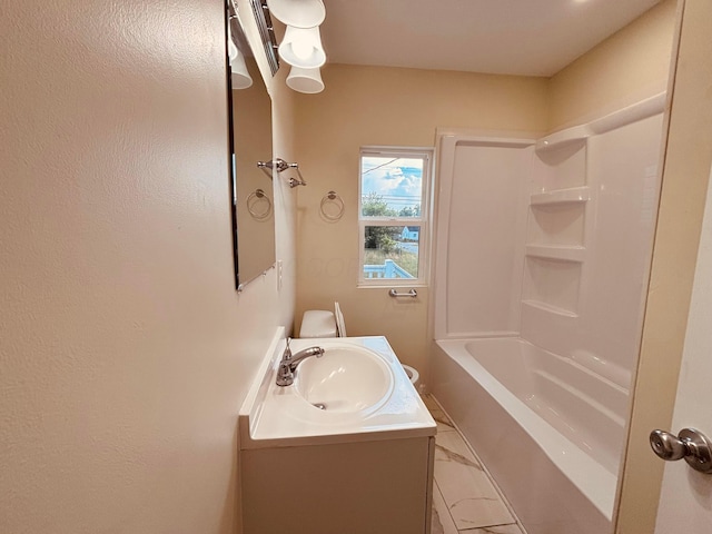 3067 E 13th Ave, Columbus, OH 43219 - full bathroom with vanity, shower / washtub combination, and marble finish floors