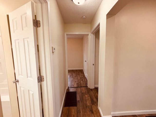 3067 E 13th Ave, Columbus, OH 43219 - corridor with dark wood-style floors and a textured ceiling