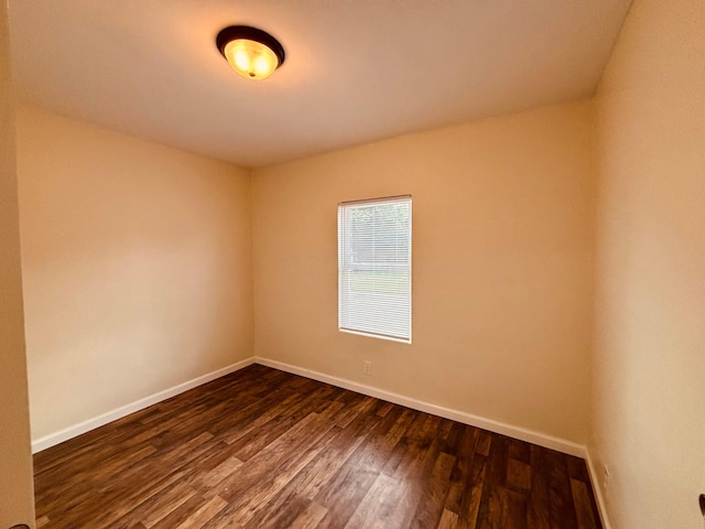 3067 E 13th Ave, Columbus, OH 43219 - empty room featuring baseboards and dark wood-type flooring