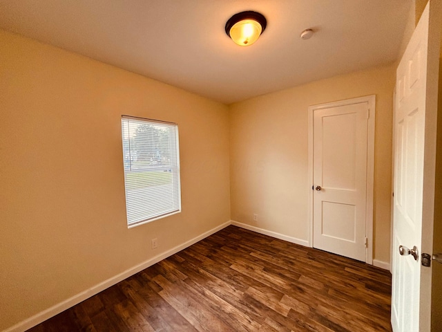 3067 E 13th Ave, Columbus, OH 43219 - spare room with dark wood-style floors and a smoke detector
