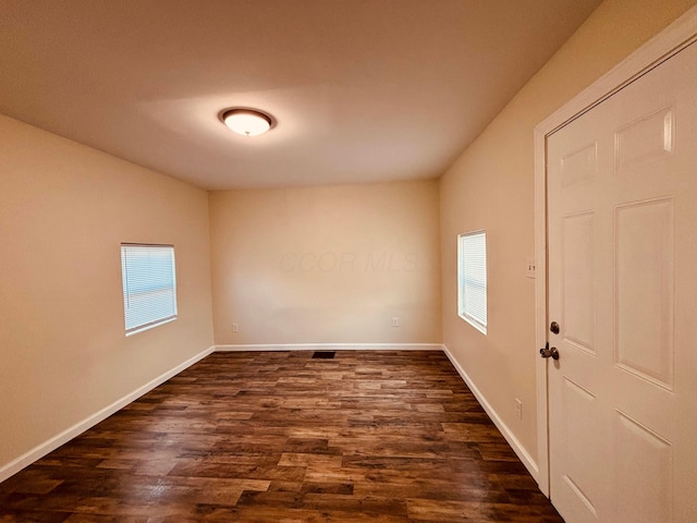 3067 E 13th Ave, Columbus, OH 43219 - unfurnished room featuring healthy amount of natural light and dark wood-style floors