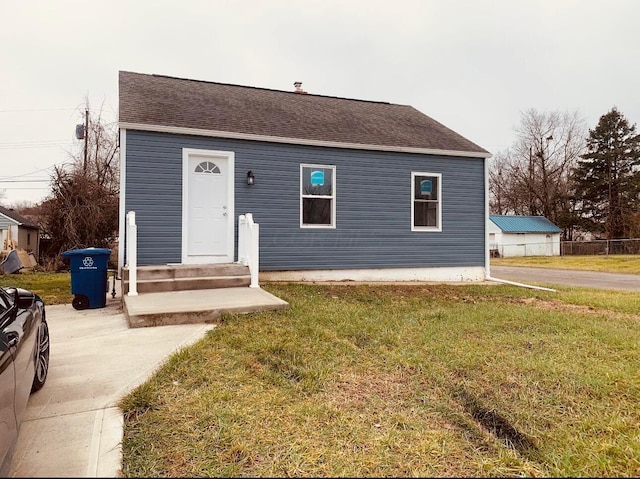 3067 E 13th Ave, Columbus, OH 43219 - view of front of home with a front yard and roof with shingles