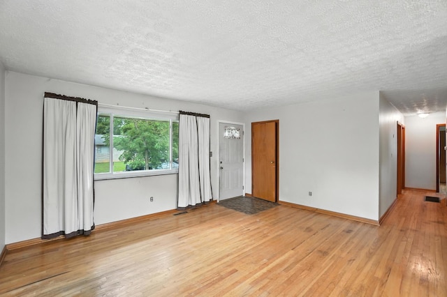 3563 Astor Ave, Columbus, OH 43227 - empty room with a textured ceiling and light wood-style flooring