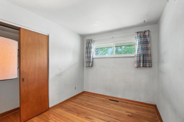 3563 Astor Ave, Columbus, OH 43227 - unfurnished bedroom with light wood-type flooring and a closet