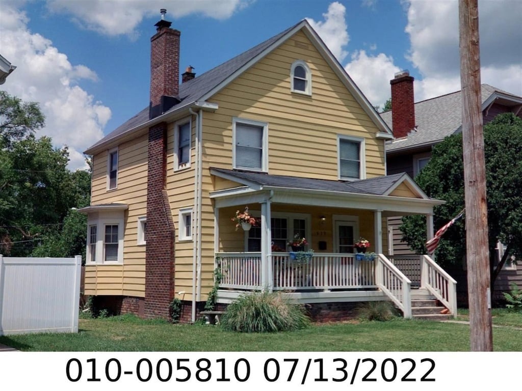 639 Bulen Ave, Columbus, OH 43205 - view of front of property with covered porch and a chimney