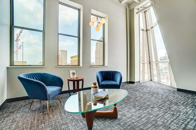 110 N 3rd St Unit 707, Columbus, OH 43215 - living area featuring carpet flooring and a towering ceiling