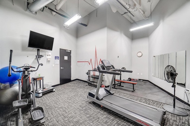 110 N 3rd St Unit 707, Columbus, OH 43215 - exercise room featuring a towering ceiling and carpet flooring