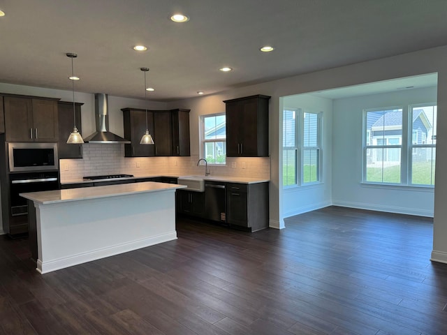 8760 Apricot Way Lot 1917, Plain City, OH 43064 - kitchen featuring wall chimney exhaust hood, stainless steel microwave, dishwashing machine, black oven, and light countertops