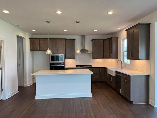8760 Apricot Way Lot 1917, Plain City, OH 43064 - kitchen featuring wall chimney exhaust hood, appliances with stainless steel finishes, dark wood-type flooring, dark brown cabinets, and recessed lighting