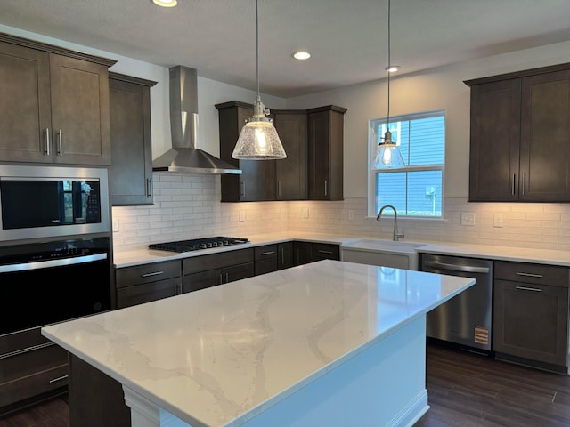 8760 Apricot Way Lot 1917, Plain City, OH 43064 - kitchen featuring appliances with stainless steel finishes, wall chimney range hood, dark brown cabinetry, and recessed lighting