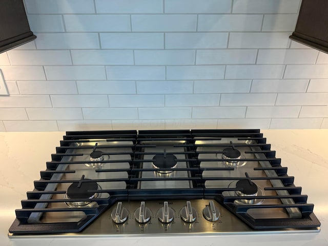 8760 Apricot Way Lot 1917, Plain City, OH 43064 - kitchen view of stainless steel gas stovetop and tasteful backsplash