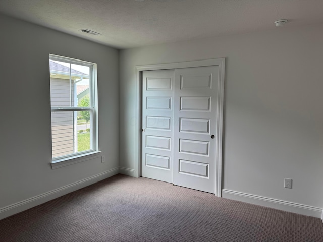 8760 Apricot Way Lot 1917, Plain City, OH 43064 - unfurnished bedroom with carpet flooring and a closet