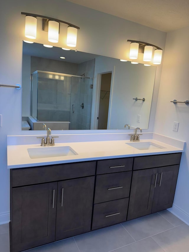 8760 Apricot Way Lot 1917, Plain City, OH 43064 - full bathroom with a shower stall, double vanity, tile patterned flooring, and a spacious closet