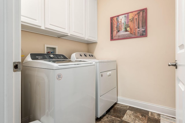 4881 Primrose Ct, Grove City, OH 43123 - laundry room with separate washer and dryer, cabinet space, and dark stone finish flooring