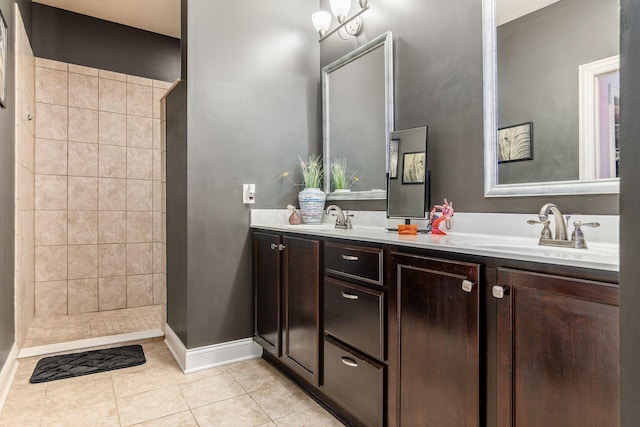 4881 Primrose Ct, Grove City, OH 43123 - bathroom with double vanity, tiled shower, and tile patterned floors