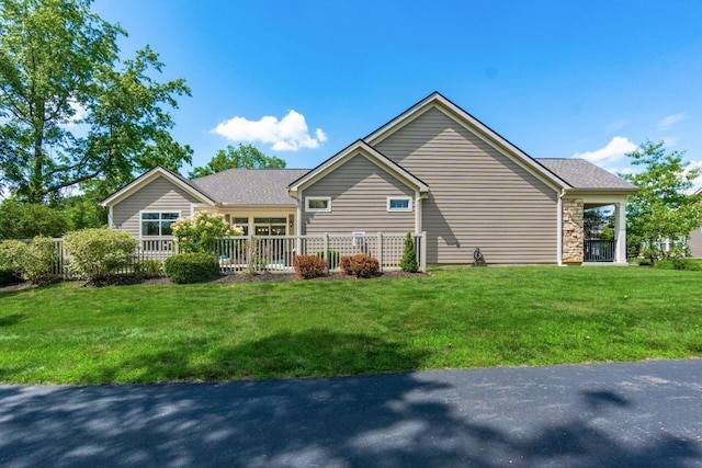 4881 Primrose Ct, Grove City, OH 43123 - back of house featuring a lawn and stone siding