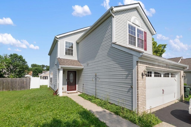 3151 Crossgate Rd, Columbus, OH 43232 - traditional-style house featuring a garage and asphalt driveway