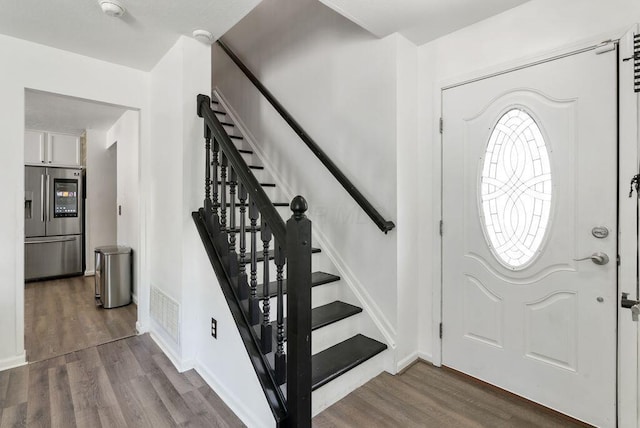 3151 Crossgate Rd, Columbus, OH 43232 - entrance foyer with stairway and wood finished floors