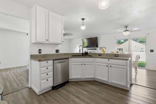3151 Crossgate Rd, Columbus, OH 43232 - kitchen featuring stainless steel dishwasher, a peninsula, white cabinetry, dark wood-style flooring, and a ceiling fan