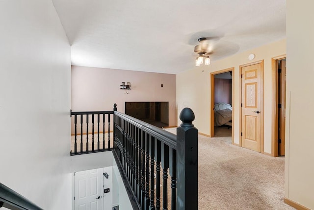 3151 Crossgate Rd, Columbus, OH 43232 - staircase with carpet floors and a ceiling fan