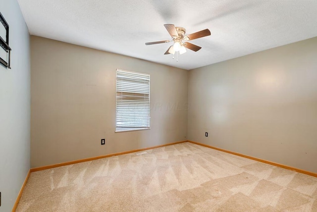 3151 Crossgate Rd, Columbus, OH 43232 - empty room featuring light carpet, ceiling fan, and a textured ceiling