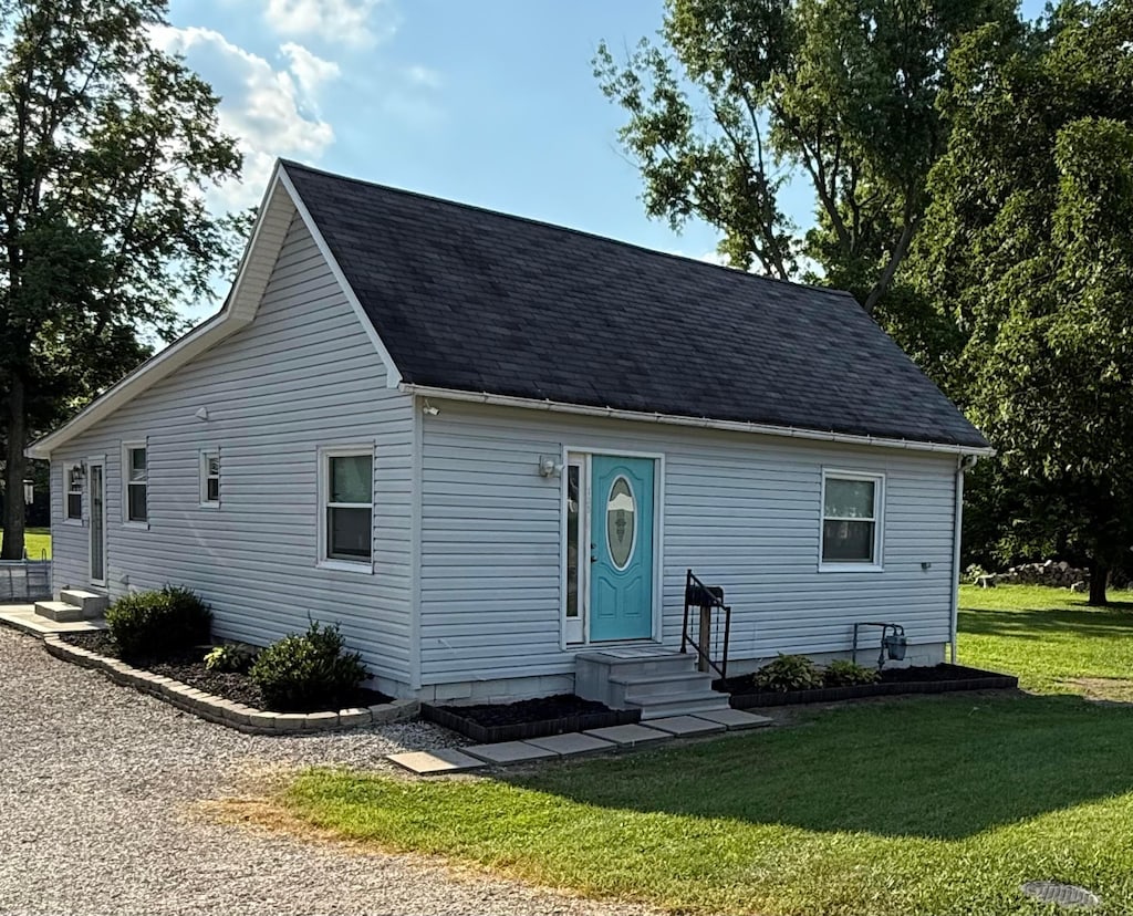 135 Pontious Ln, Circleville, OH 43113 - view of front of property featuring a front lawn and a shingled roof