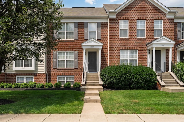 3839 Rubythroat Dr, Columbus, OH 43230 - colonial house featuring entry steps, a front yard, and brick siding