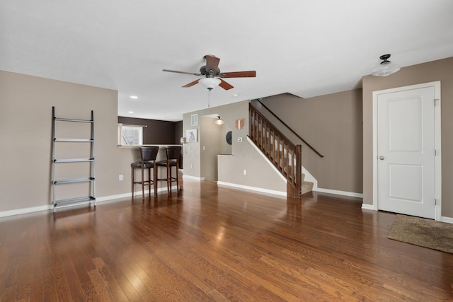 3839 Rubythroat Dr, Columbus, OH 43230 - unfurnished living room with a ceiling fan, stairway, wood finished floors, and recessed lighting