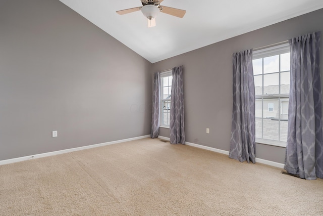 3839 Rubythroat Dr, Columbus, OH 43230 - spare room featuring light colored carpet, ceiling fan, and vaulted ceiling