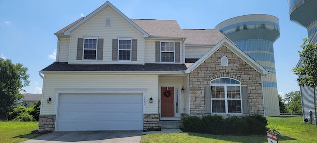 3386 Buhrmill Rd, Reynoldsburg, OH 43068 - view of front facade with stone siding, concrete driveway, and a front lawn