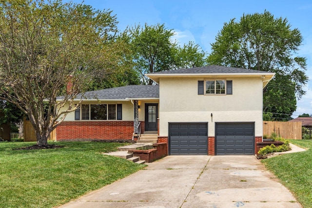 2664 Sonata Dr, Columbus, OH 43209 - tri-level home with a garage, driveway, stucco siding, and brick siding