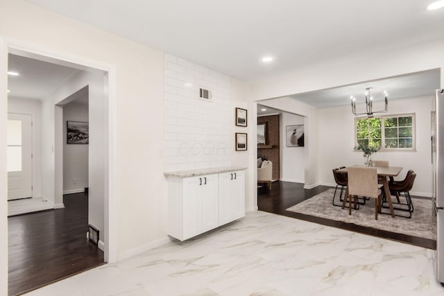 2664 Sonata Dr, Columbus, OH 43209 - dining room featuring recessed lighting, a chandelier, and marble finish floors