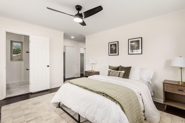 2664 Sonata Dr, Columbus, OH 43209 - bedroom featuring crown molding, wood finished floors, a closet, and ceiling fan