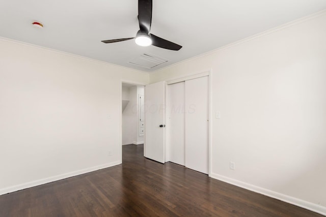 2664 Sonata Dr, Columbus, OH 43209 - unfurnished bedroom with dark wood finished floors, a closet, ornamental molding, and ceiling fan