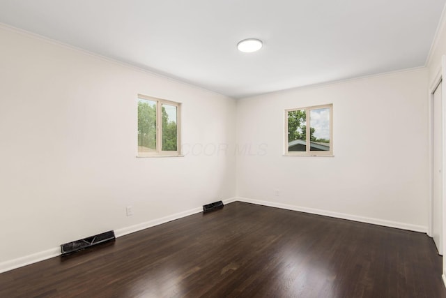 2664 Sonata Dr, Columbus, OH 43209 - spare room with healthy amount of natural light, dark wood-style floors, and crown molding