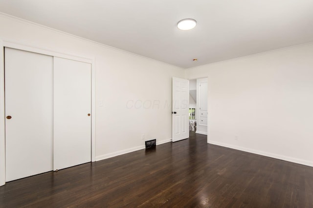 2664 Sonata Dr, Columbus, OH 43209 - unfurnished bedroom featuring wood finished floors, crown molding, and a closet