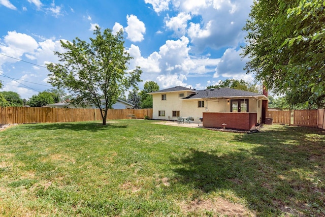 2664 Sonata Dr, Columbus, OH 43209 - back of property with a fenced backyard, a patio, and stucco siding