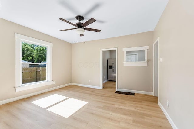 3189 E 6th Ave, Columbus, OH 43219 - empty room featuring light wood-style flooring and ceiling fan