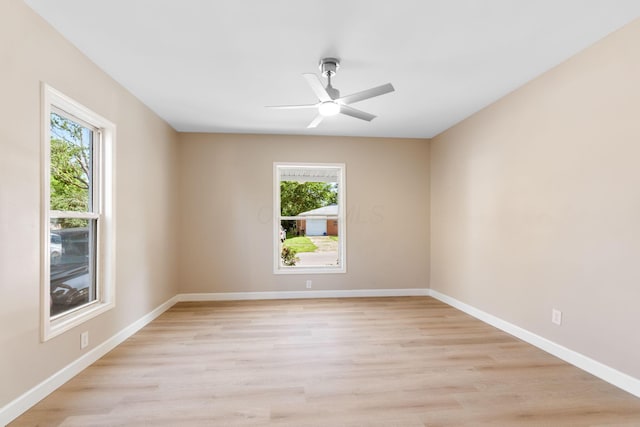 3189 E 6th Ave, Columbus, OH 43219 - empty room with plenty of natural light, light wood-style flooring, and ceiling fan