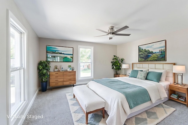 3189 E 6th Ave, Columbus, OH 43219 - carpeted bedroom featuring a ceiling fan and baseboards